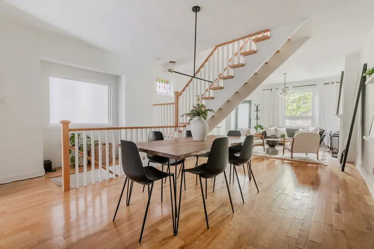 Open concept dining room under the central staircase