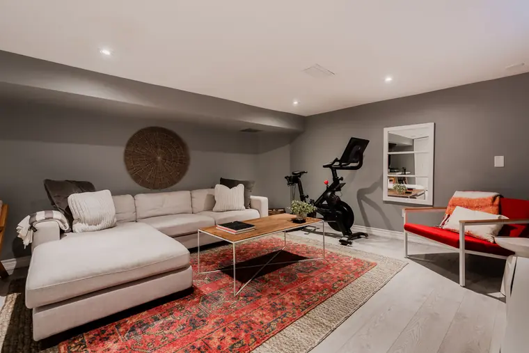 Finished basement family room with sectional sofa
